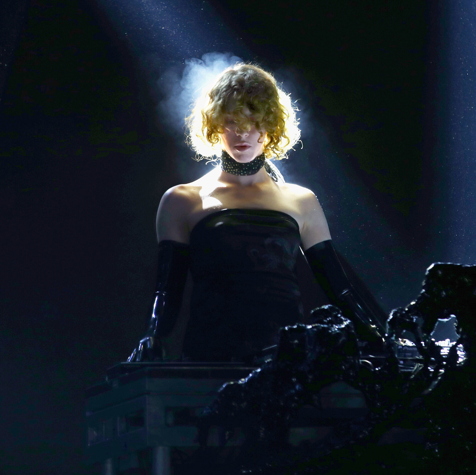 Sophie on stage, focused on her music